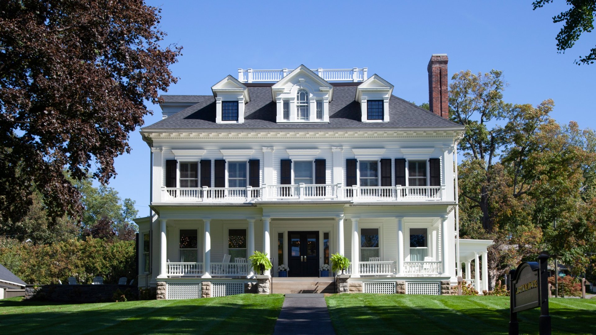 Front view of white Zabriskie House.