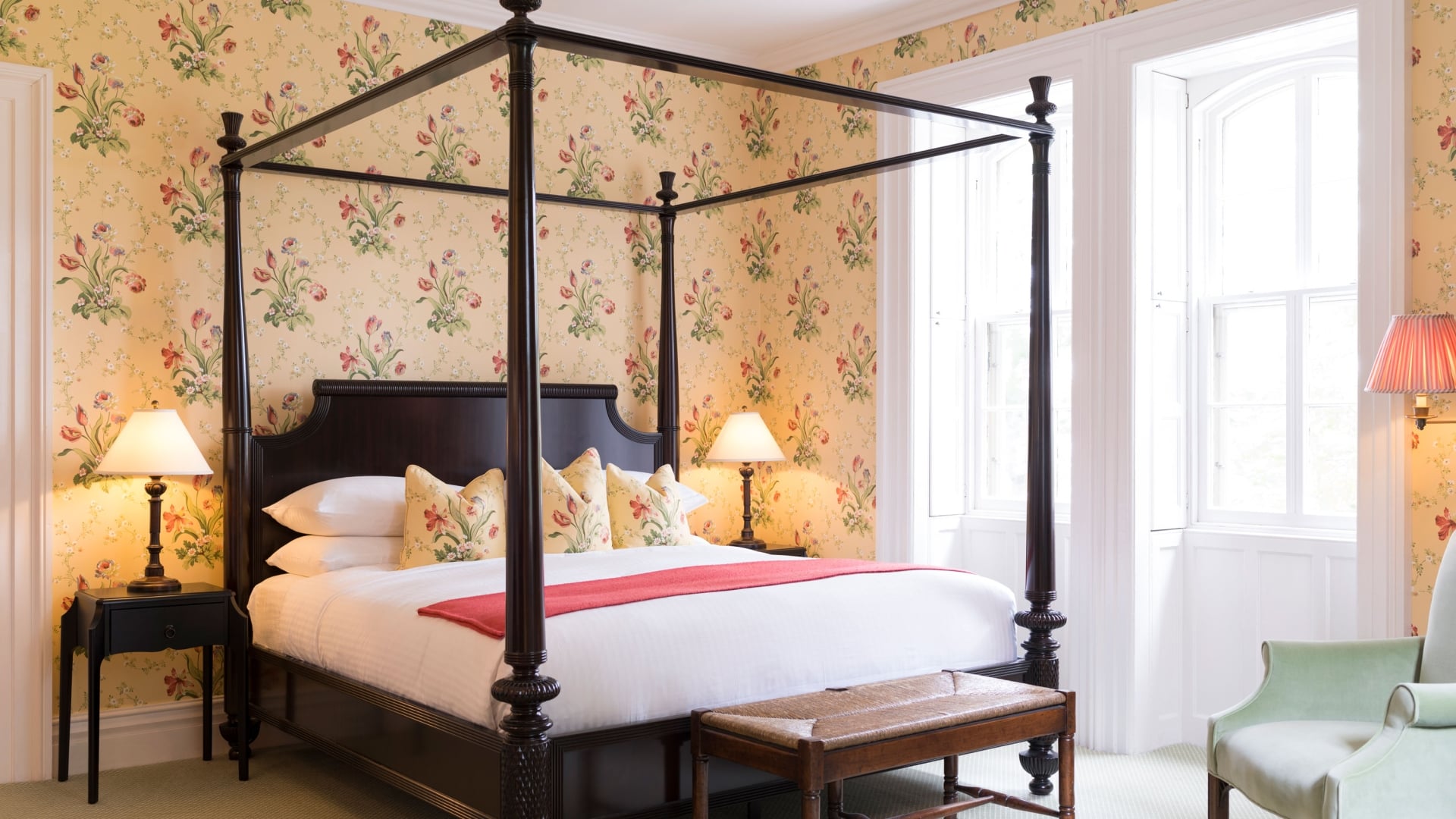 E.B. Morgan House Bedroom with floral wallpaper and four poster bed.