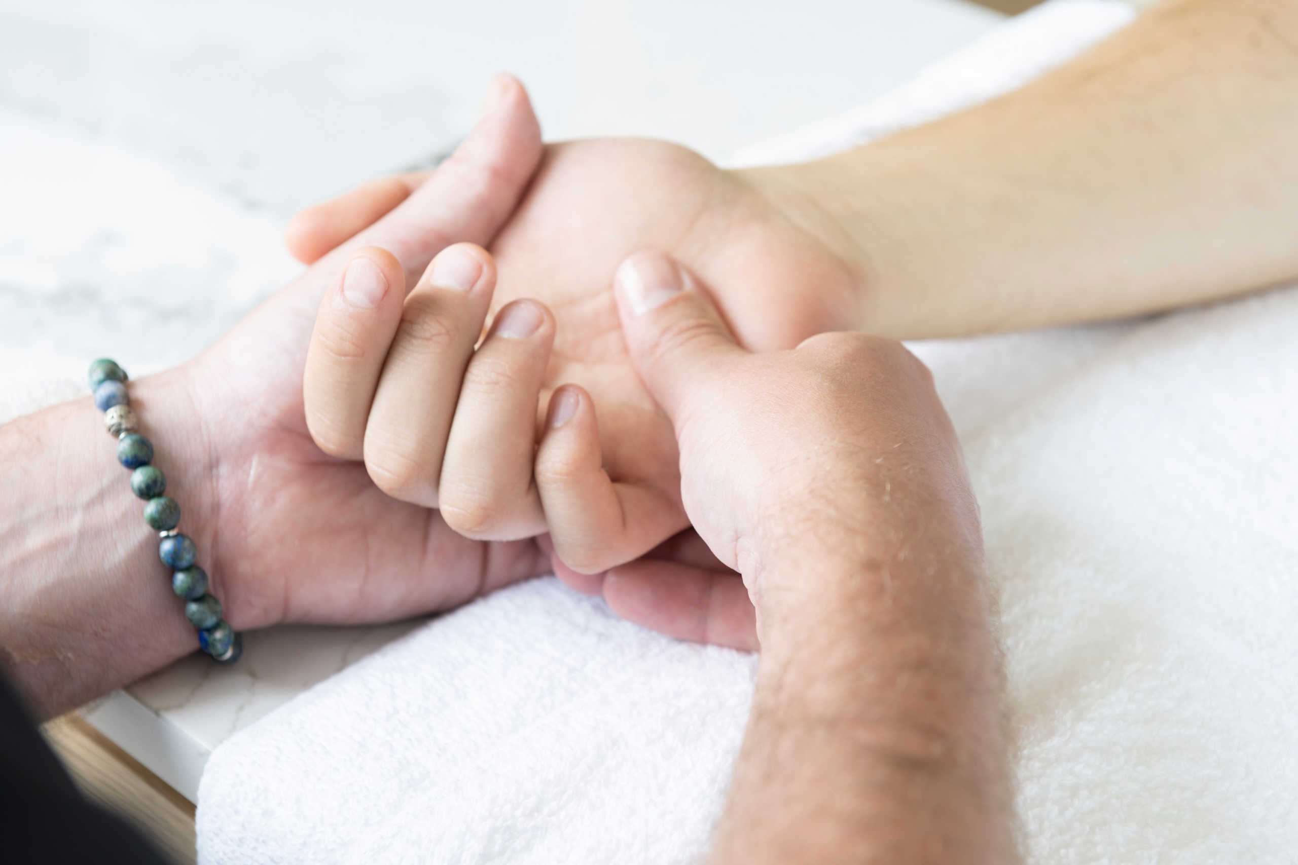 Skilled worker providing a relaxing hand massage.