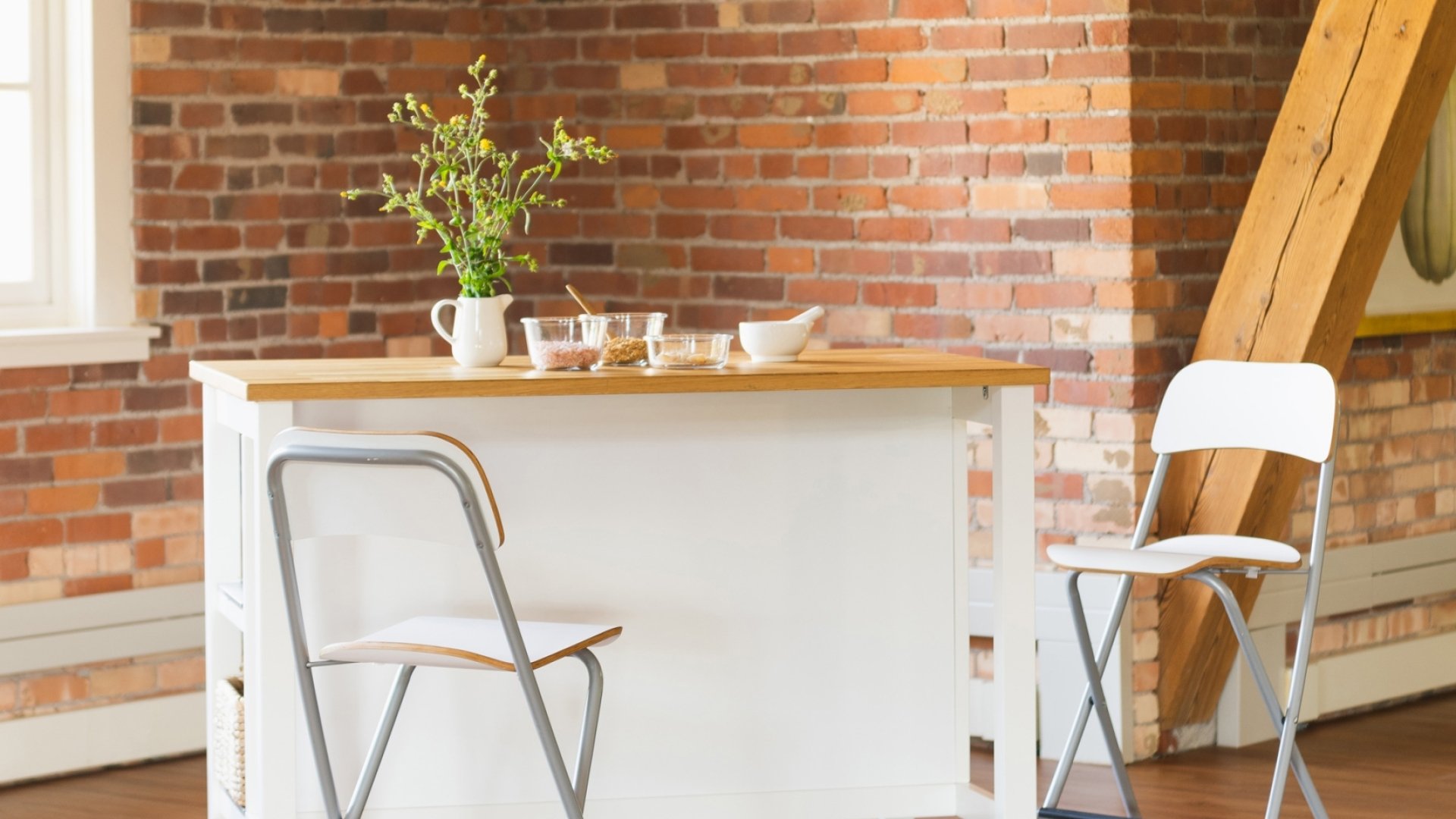 The Loft consult table with two white chairs.