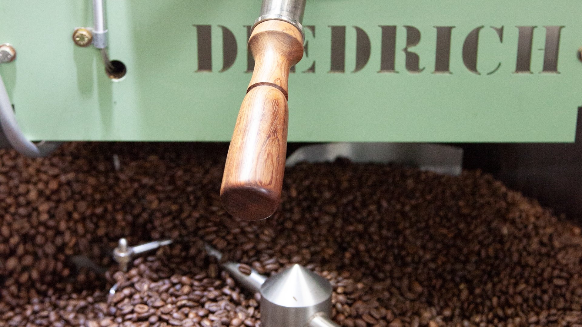 Roasting coffee beans in a coffee roaster.