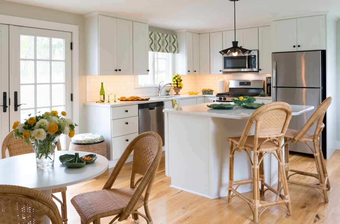 Kitchen with rattan table and chairs.