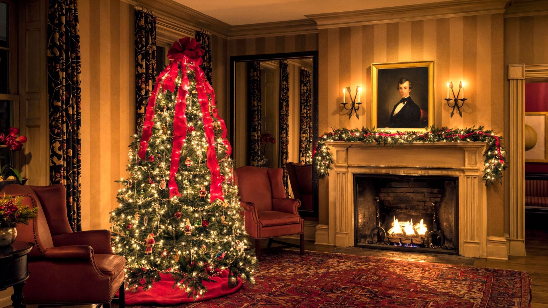 Festive Christmas tree in the center of the lobby at Inns of Aurora.