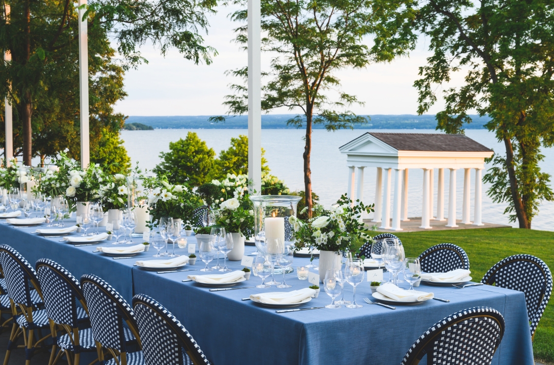 Blue and white table decorated for a wedding reception at Inns of Aurora.