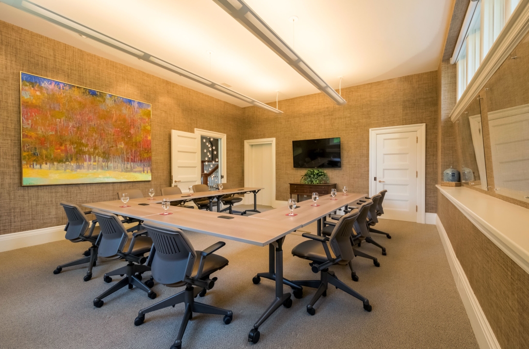 Conference room with large painting in the Rowland House.