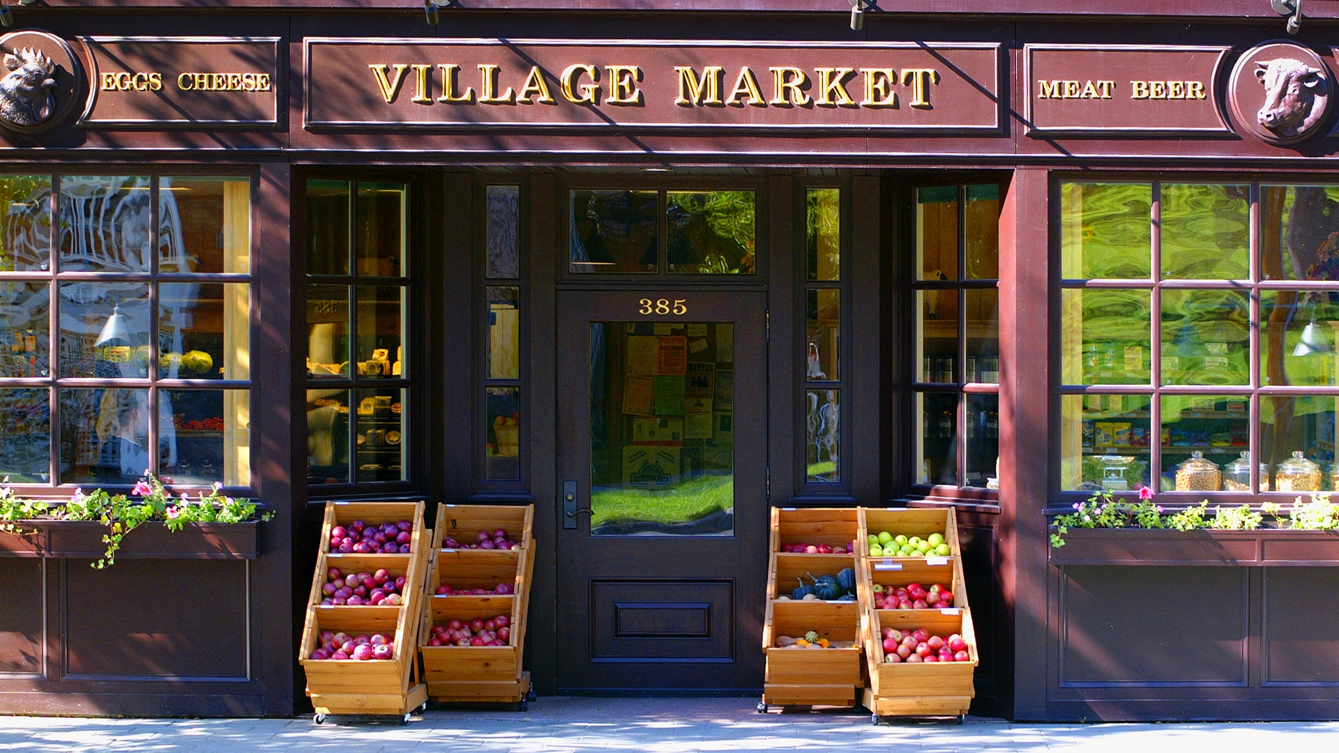 Front store view of purple building of The Village Market.