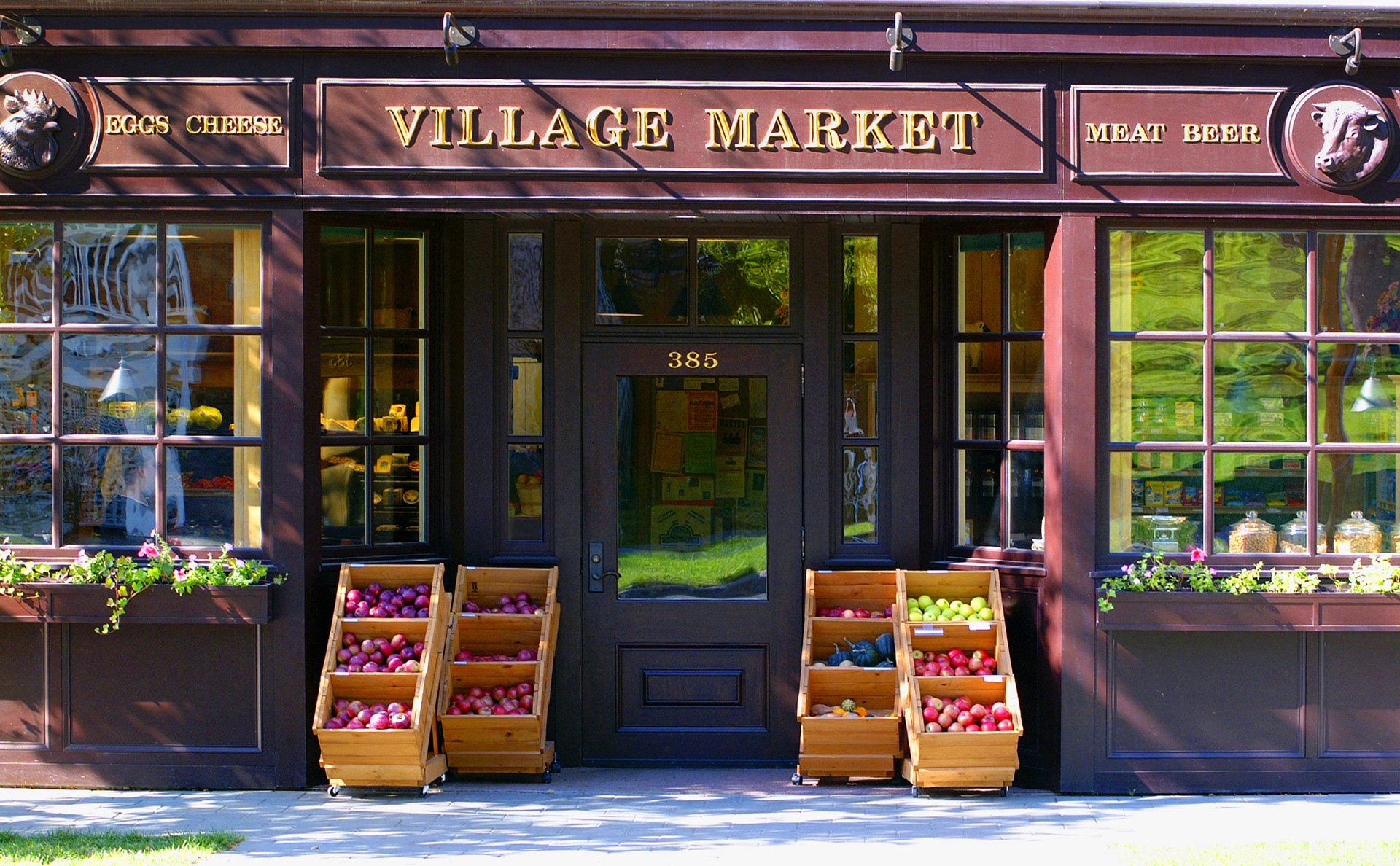 Front store view of purple building of The Village Market.