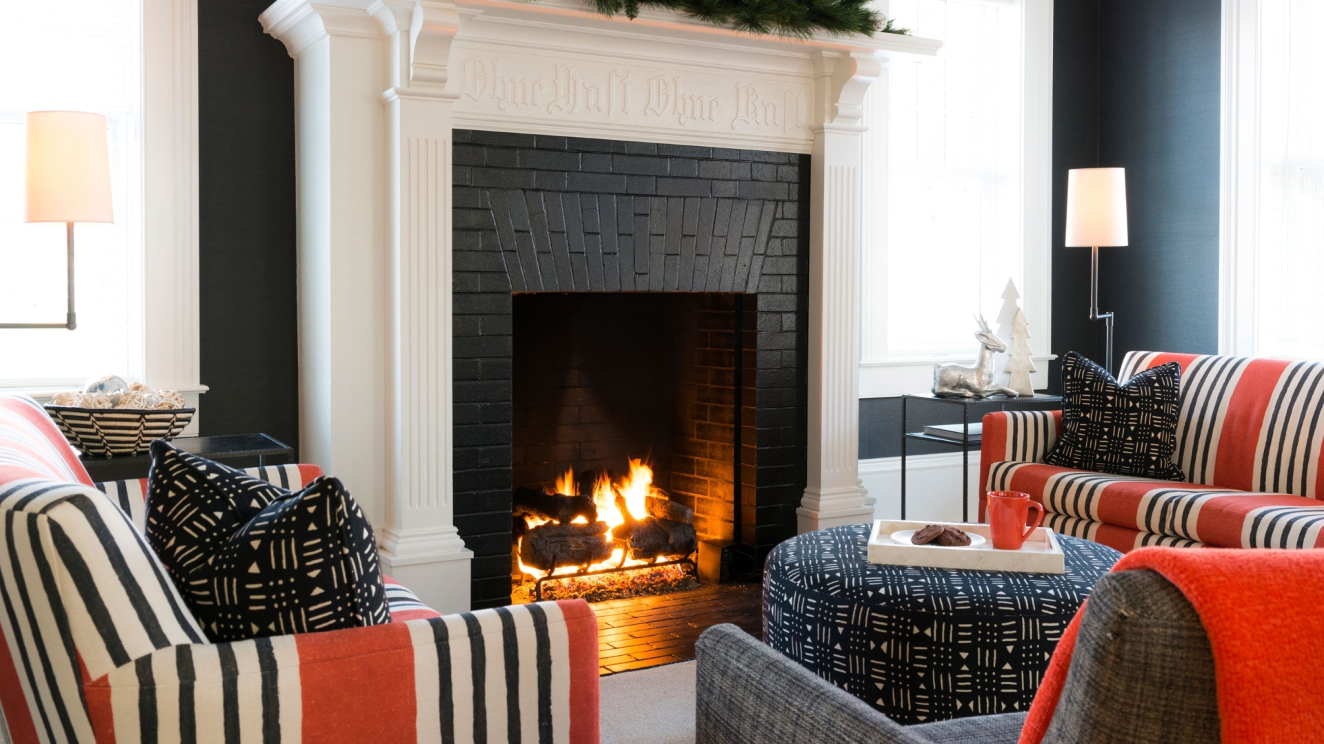 Wallcourt Hall's living space with white fireplace.