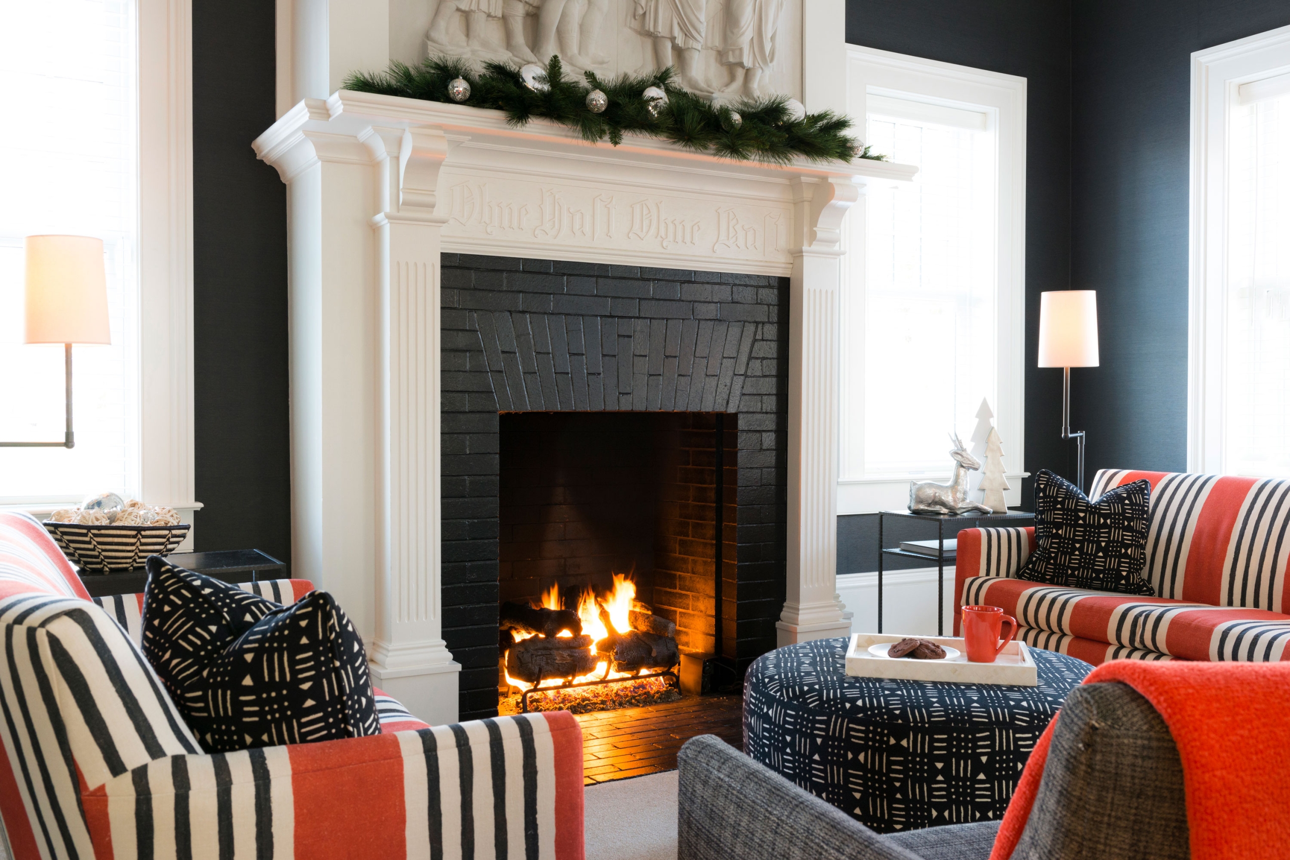 Wallcourt Hall's living space with white fireplace.